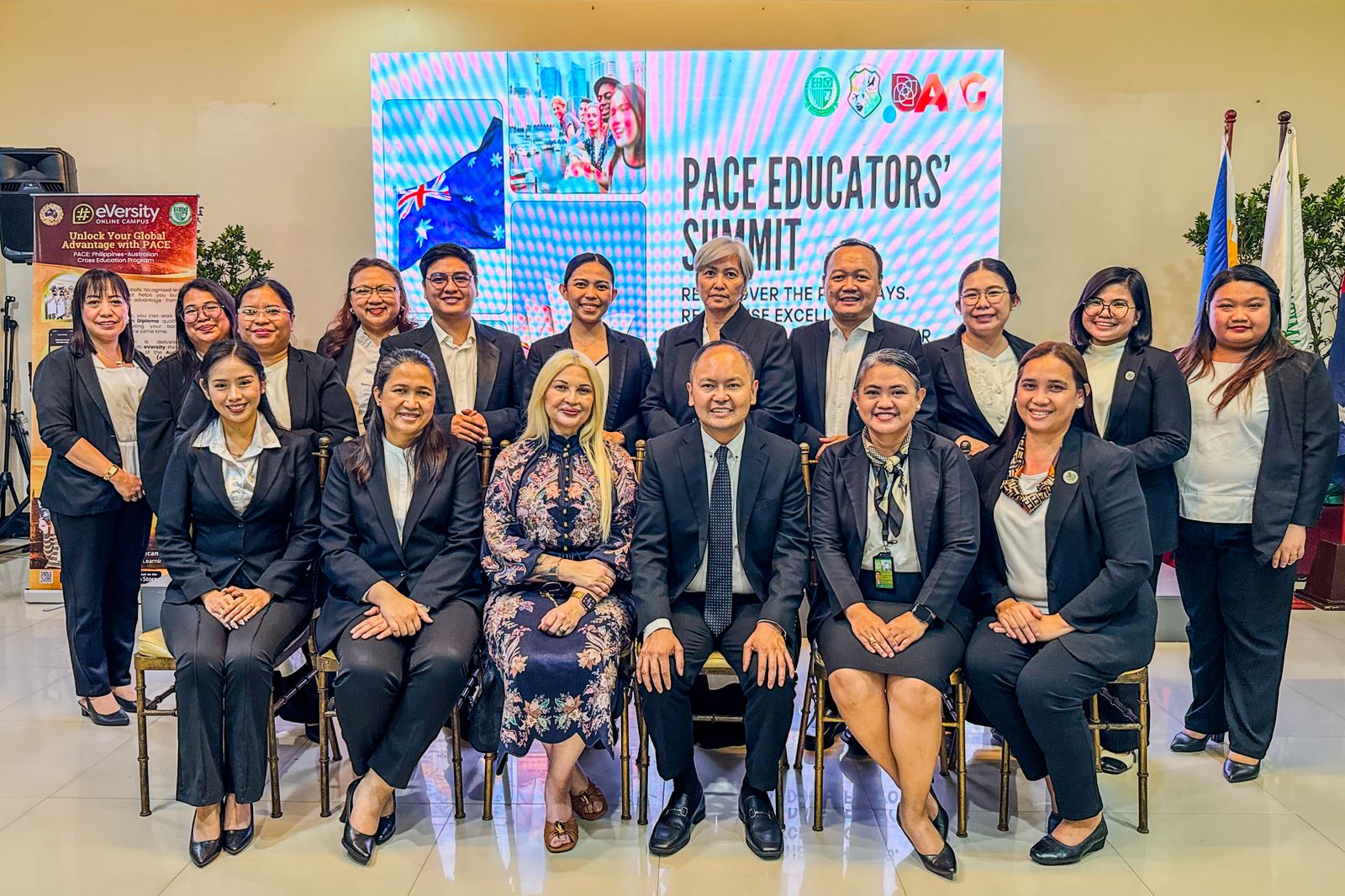 Educators and guests gathered on stage beneath a PACE Educators&rsquo; Summit screen, with the Philippine and Australian flags